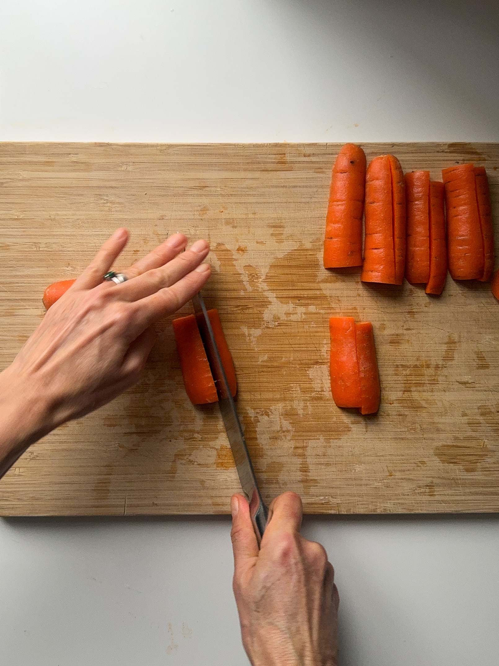 carrots being cut lengthwise