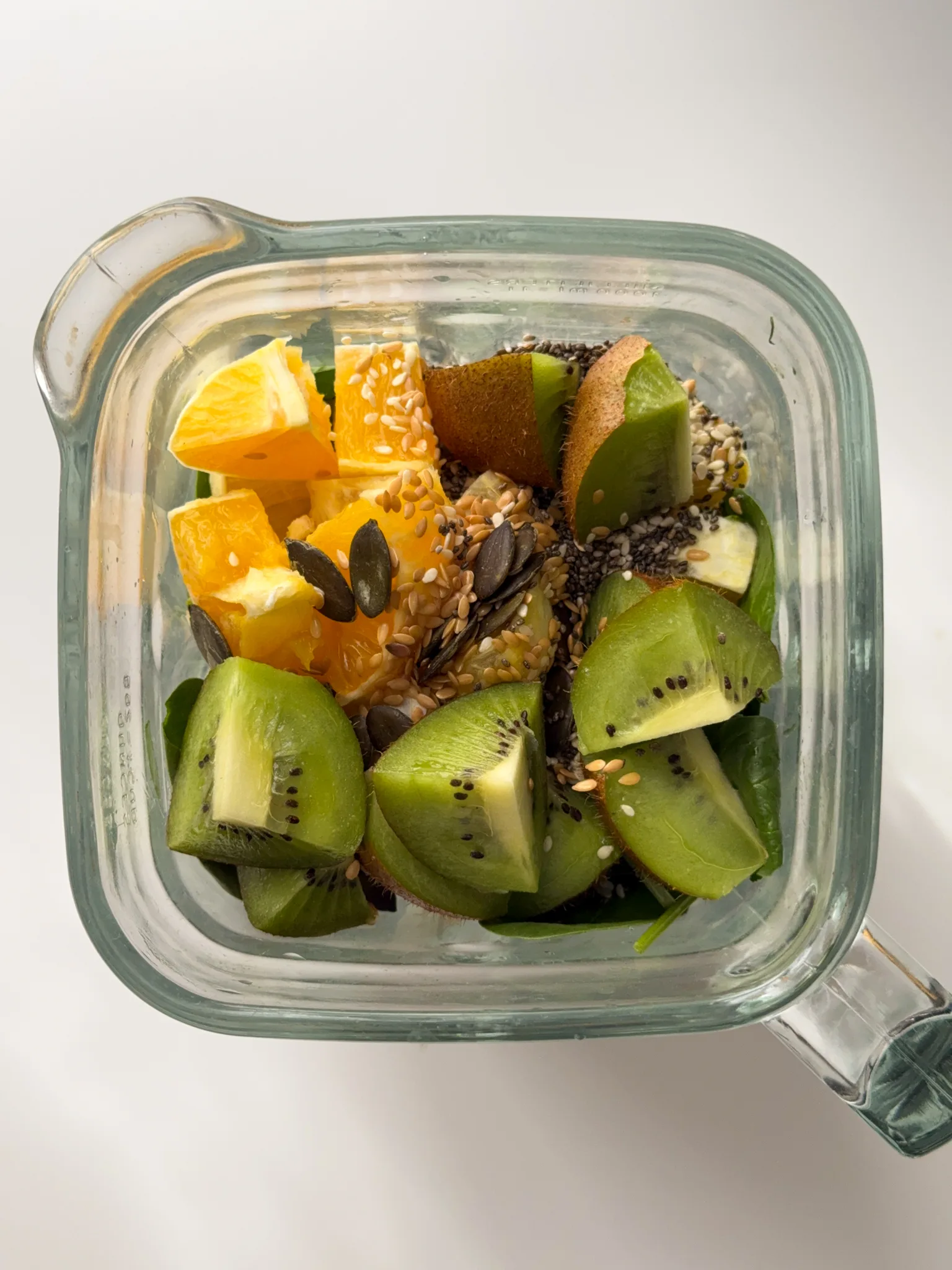 Vegetables & fruits inside a glass jar.