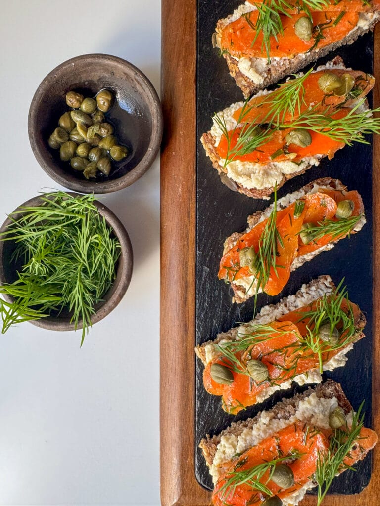 Vegan Smoked Carrot Lox on a black slate board