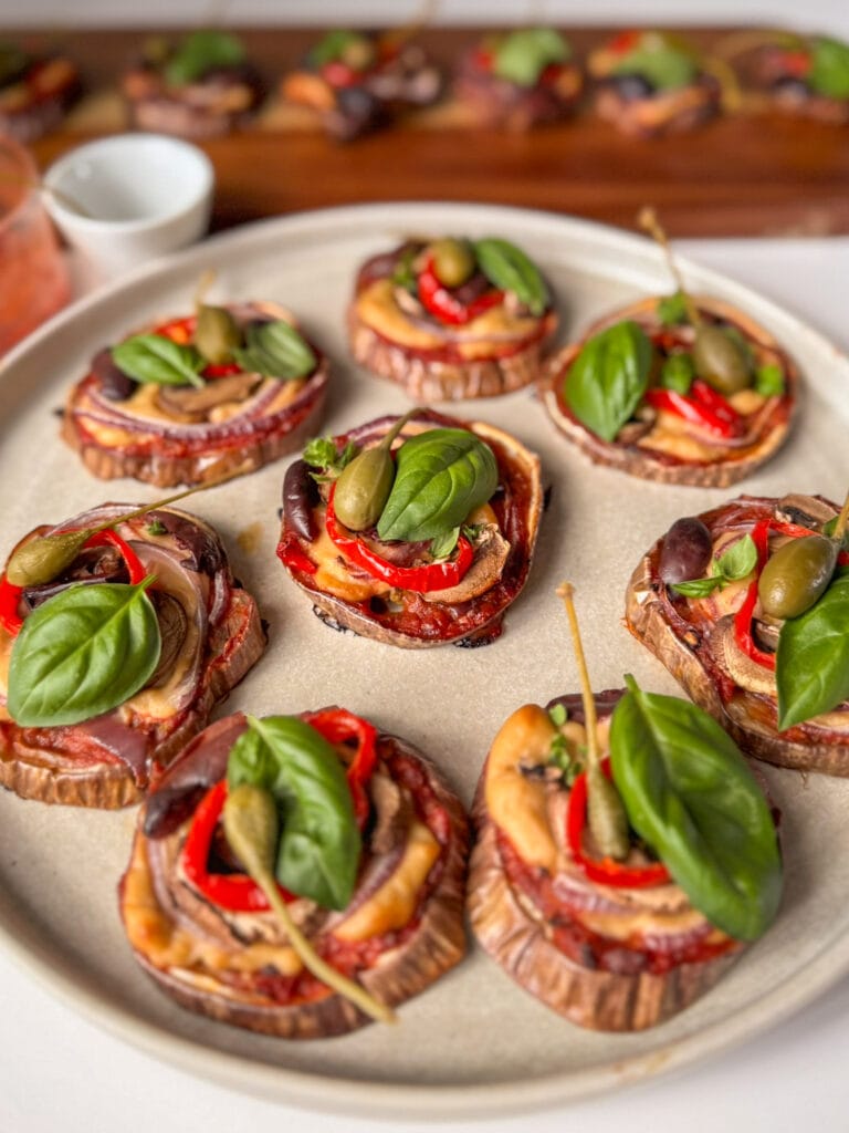 Mini Eggplant Pizzas with vegan mozzarella, mushrooms, capers and basil
