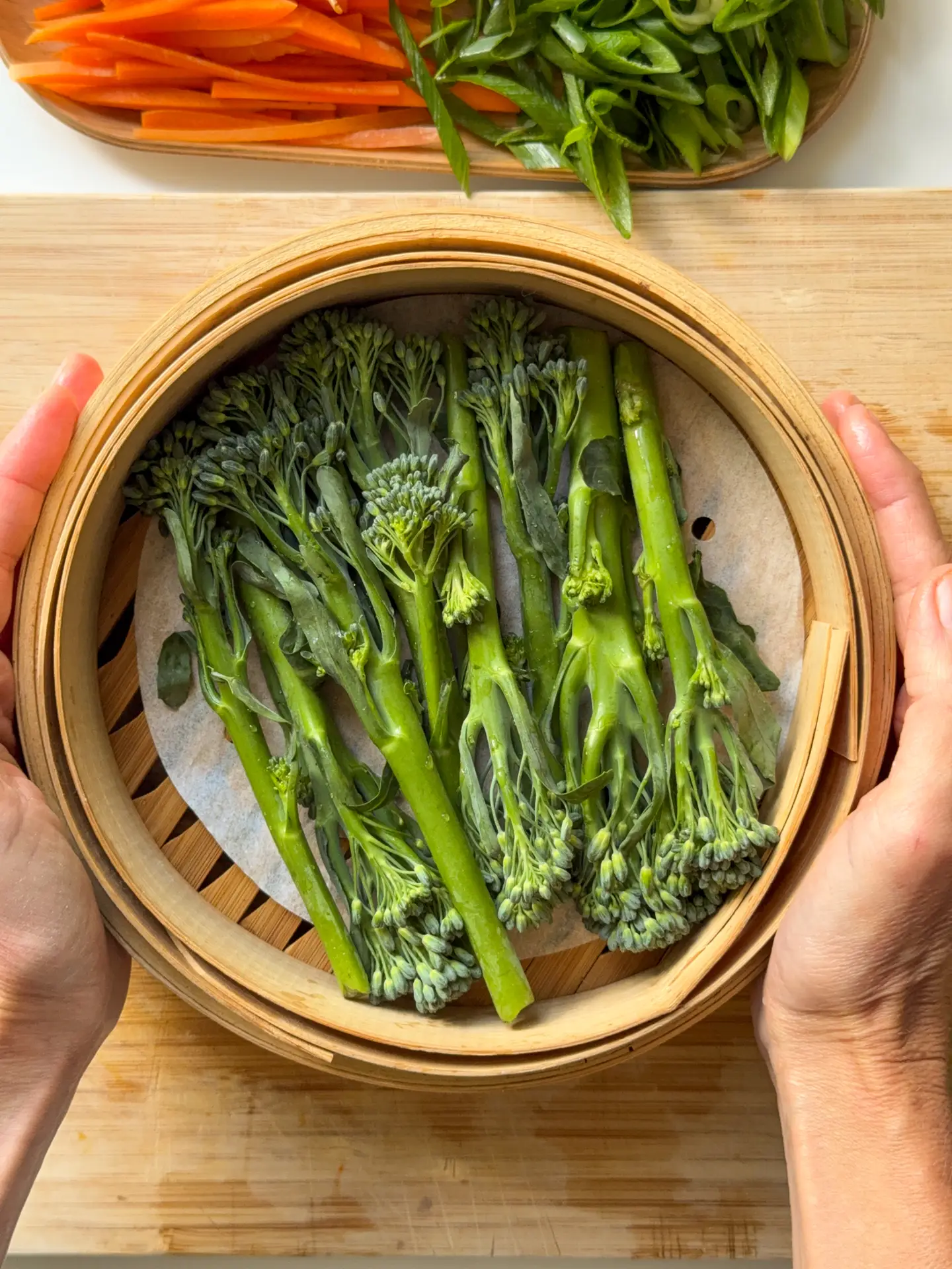 Carrots, julianne, spring onions thinly cut and tenderstem broccoli on a steam basket