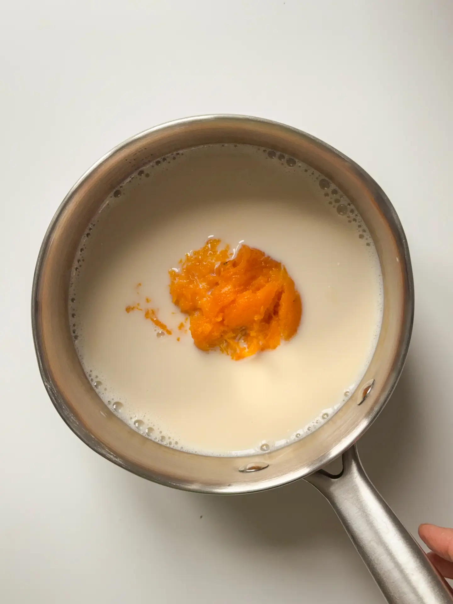 Soy milk and pumpkin puree in a sauce pan